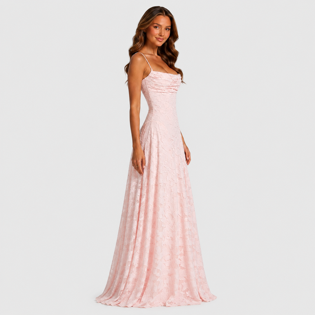 Women's textured floral maxi dress with fitted bodice, delicate shoulder straps, and flowing skirt for elegant wedding guest and formal occasion wear.