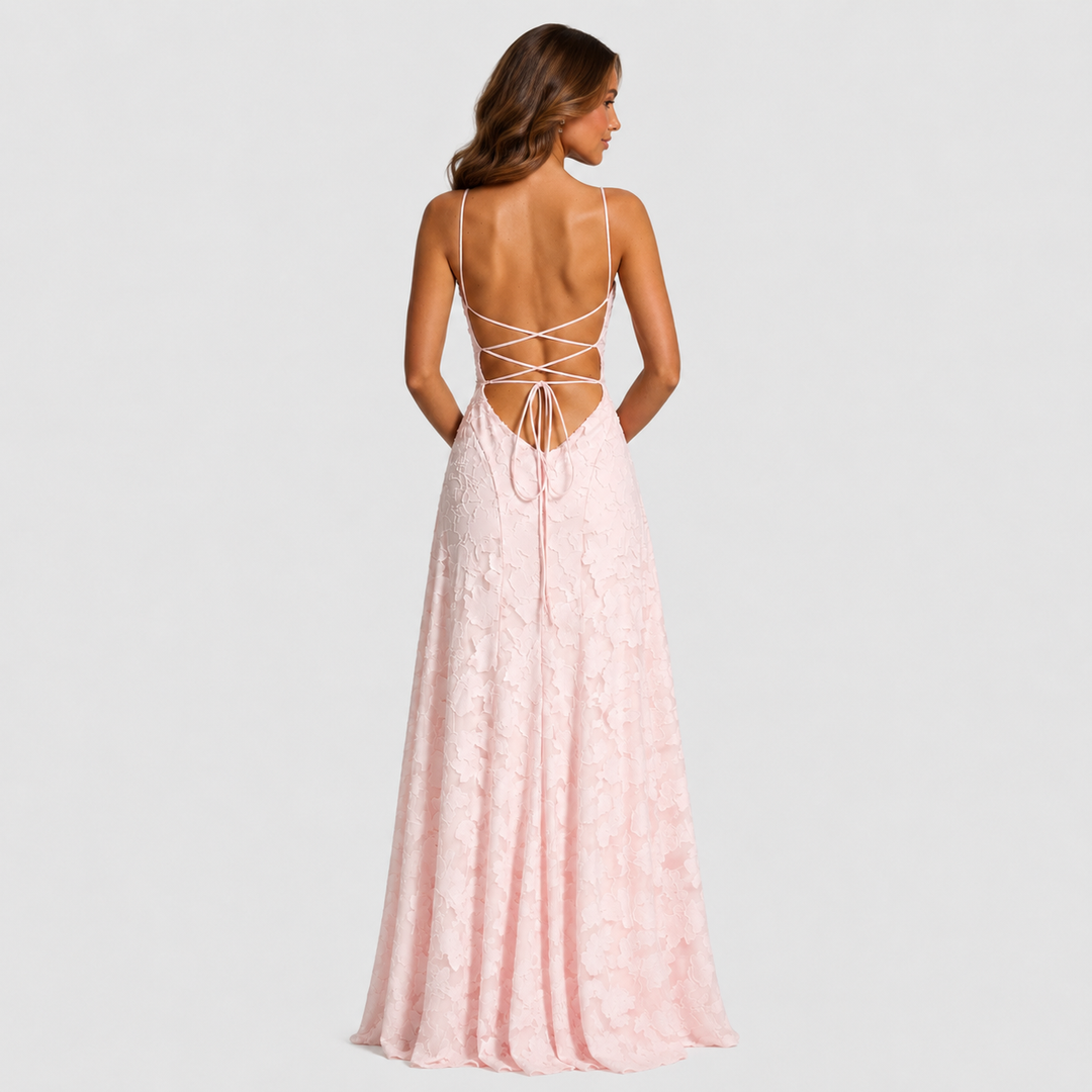 Women's textured floral maxi dress with fitted bodice, delicate shoulder straps, and flowing skirt for elegant wedding guest and formal occasion wear.