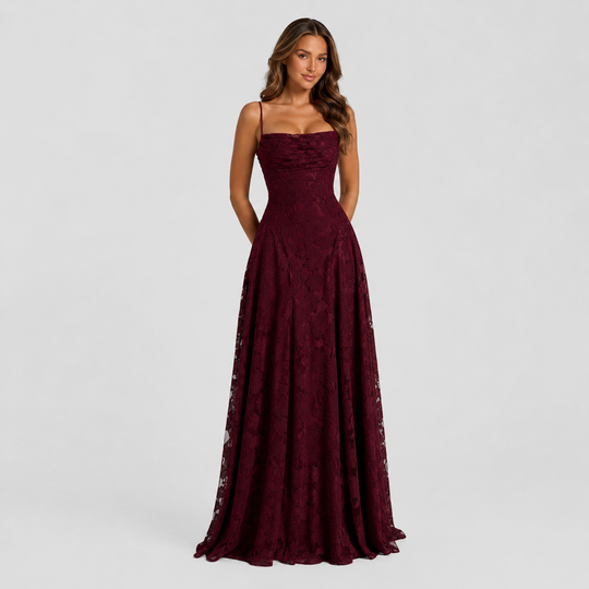 Women's textured floral maxi dress with fitted bodice, delicate shoulder straps, and flowing skirt for elegant wedding guest and formal occasion wear.