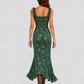 Woman wearing a boho floral maxi dress with a flowing silhouette, side slit detail, and lightweight fabric, styled for a relaxed summer occasion.