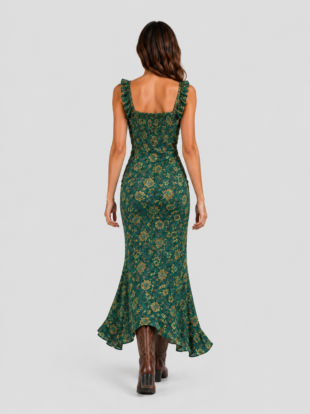 Woman wearing a boho floral maxi dress with a flowing silhouette, side slit detail, and lightweight fabric, styled for a relaxed summer occasion.