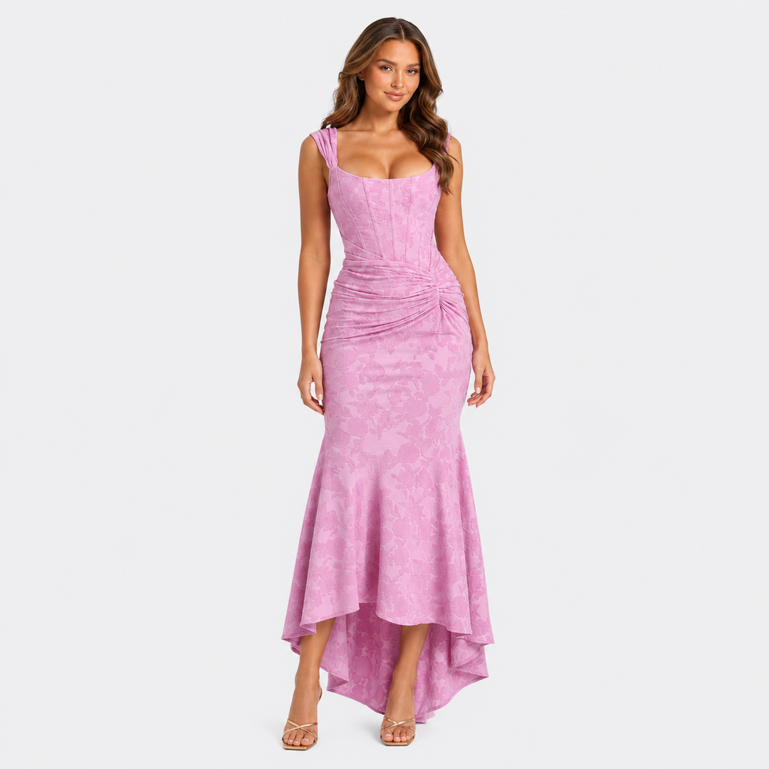 Women's floral textured corset maxi dress with ruched waist and asymmetrical fishtail hem in a feminine occasionwear silhouette.