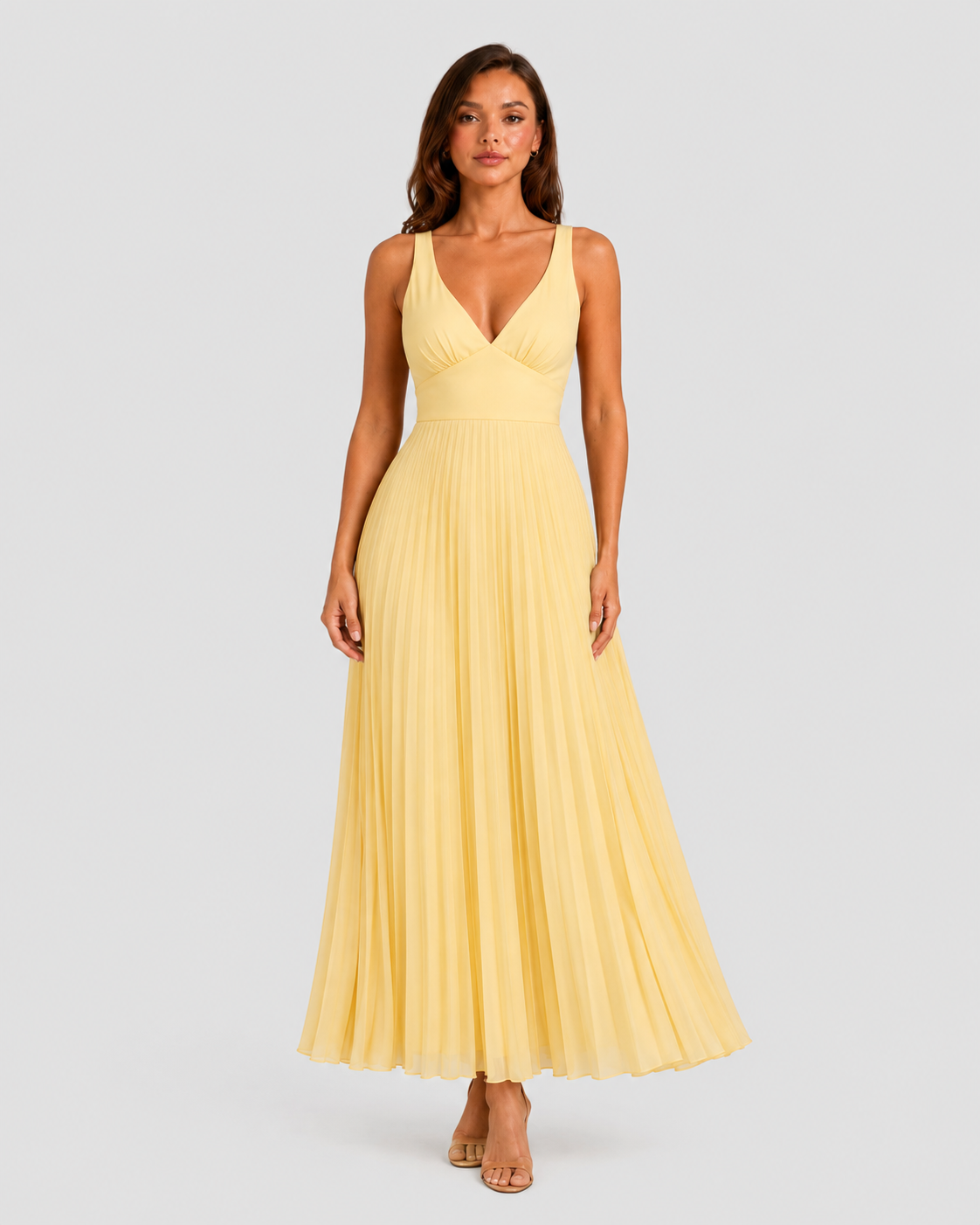 Women's yellow satin-feel pleated maxi dress with defined waist and flowing skirt, elegant occasionwear for weddings, formal events, and summer celebrations.