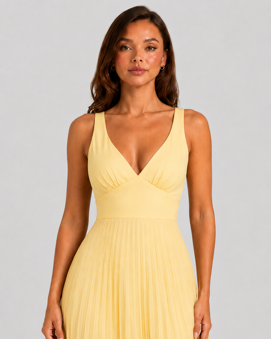 Women's yellow satin-feel pleated maxi dress with defined waist and flowing skirt, elegant occasionwear for weddings, formal events, and summer celebrations.