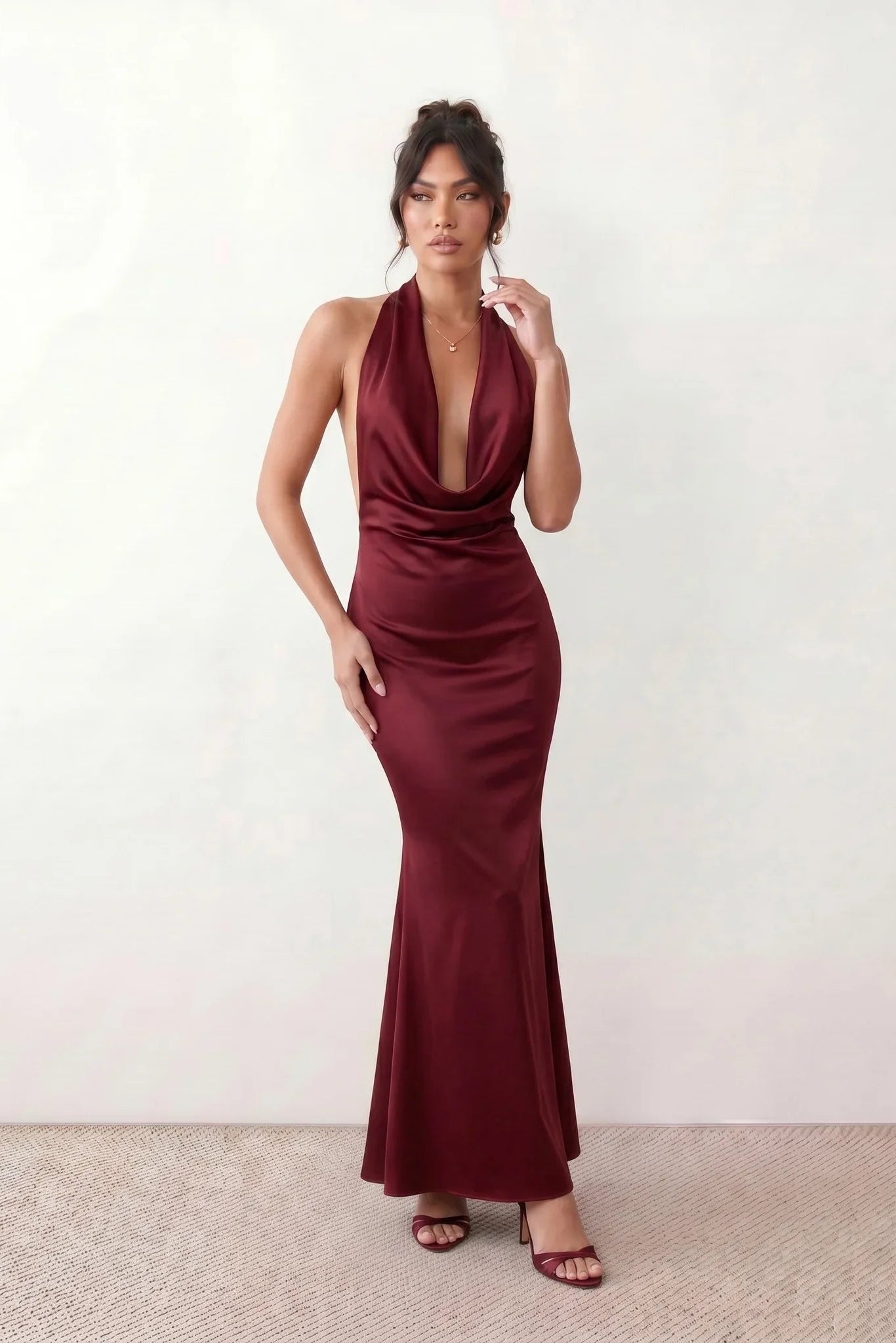 Shop the Women's Georgina Satin Cowl Neck Halter Maxi Dress. Featuring glossy satin, a draped halter neckline, open tie-back design, and a flattering mermaid silhouette, this elegant floor-length gown is perfect for weddings, black-tie events, proms, galas, and special occasions.