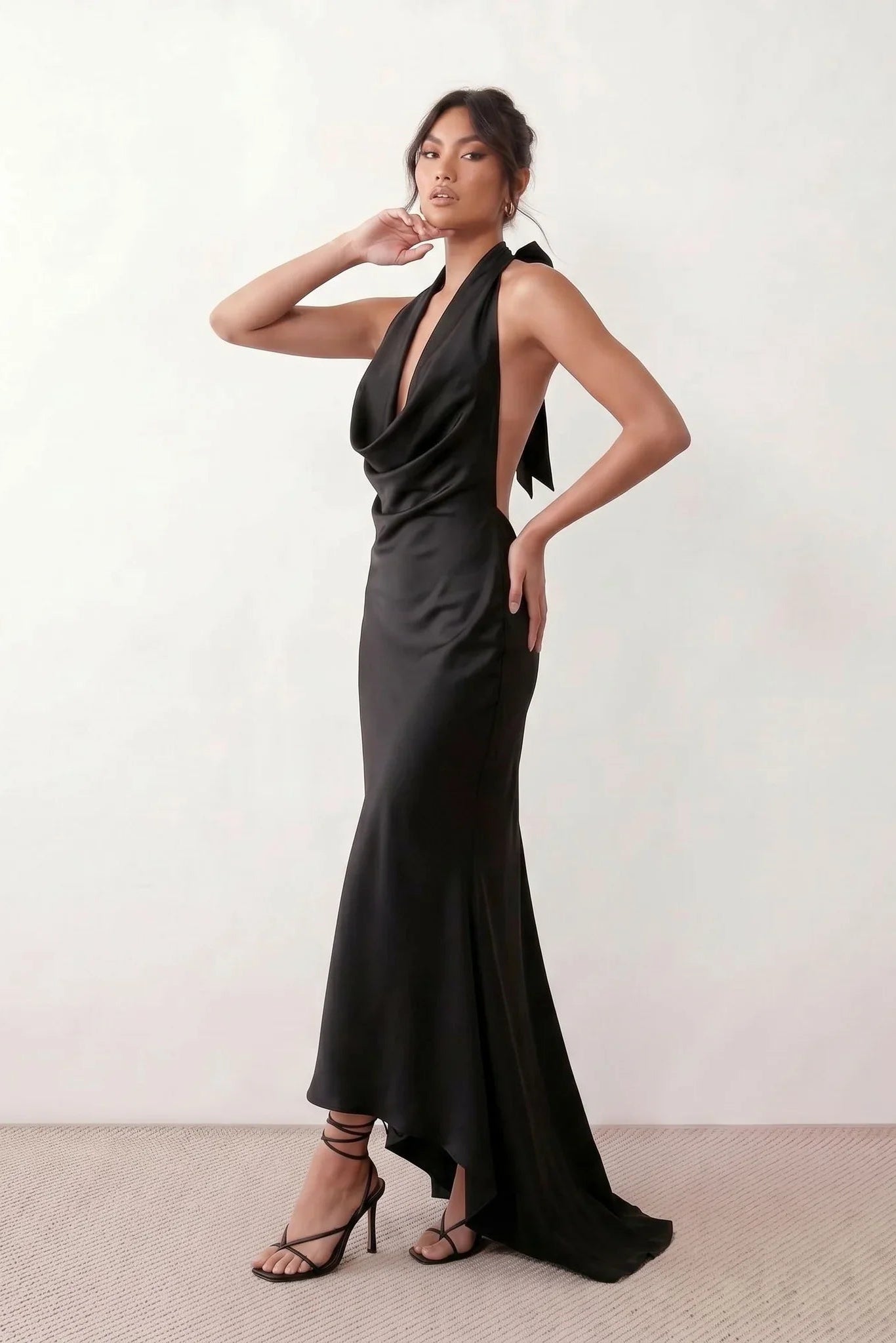 Shop the Women's Georgina Satin Cowl Neck Halter Maxi Dress. Featuring glossy satin, a draped halter neckline, open tie-back design, and a flattering mermaid silhouette, this elegant floor-length gown is perfect for weddings, black-tie events, proms, galas, and special occasions.