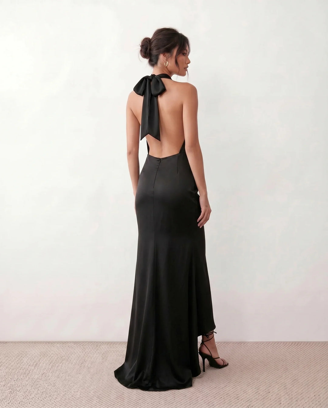 Shop the Women's Georgina Satin Cowl Neck Halter Maxi Dress. Featuring glossy satin, a draped halter neckline, open tie-back design, and a flattering mermaid silhouette, this elegant floor-length gown is perfect for weddings, black-tie events, proms, galas, and special occasions.