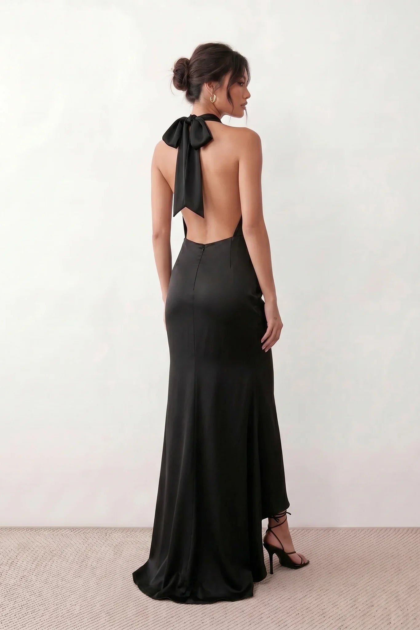 Shop the Women's Georgina Satin Cowl Neck Halter Maxi Dress. Featuring glossy satin, a draped halter neckline, open tie-back design, and a flattering mermaid silhouette, this elegant floor-length gown is perfect for weddings, black-tie events, proms, galas, and special occasions.