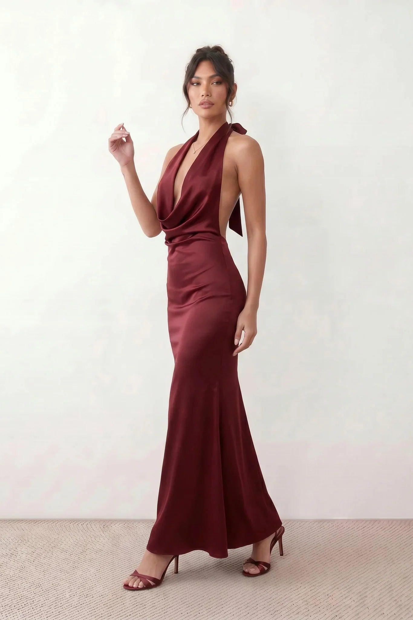 Shop the Women's Georgina Satin Cowl Neck Halter Maxi Dress. Featuring glossy satin, a draped halter neckline, open tie-back design, and a flattering mermaid silhouette, this elegant floor-length gown is perfect for weddings, black-tie events, proms, galas, and special occasions.