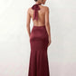 Shop the Women's Georgina Satin Cowl Neck Halter Maxi Dress. Featuring glossy satin, a draped halter neckline, open tie-back design, and a flattering mermaid silhouette, this elegant floor-length gown is perfect for weddings, black-tie events, proms, galas, and special occasions.