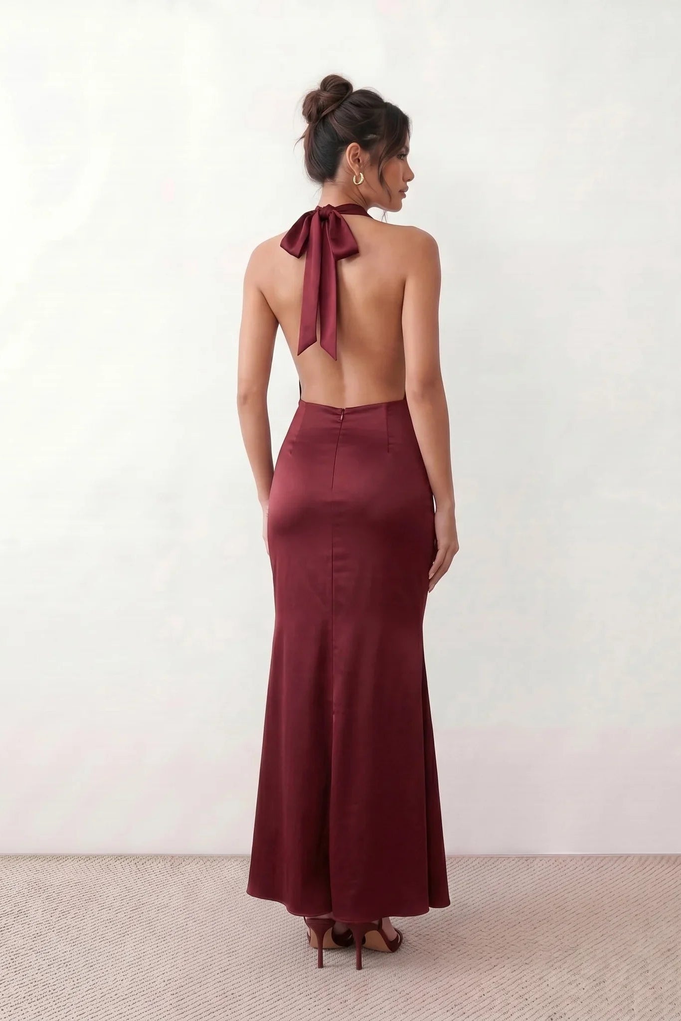 Shop the Women's Georgina Satin Cowl Neck Halter Maxi Dress. Featuring glossy satin, a draped halter neckline, open tie-back design, and a flattering mermaid silhouette, this elegant floor-length gown is perfect for weddings, black-tie events, proms, galas, and special occasions.