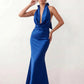 Shop the Women's Georgina Satin Cowl Neck Halter Maxi Dress. Featuring glossy satin, a draped halter neckline, open tie-back design, and a flattering mermaid silhouette, this elegant floor-length gown is perfect for weddings, black-tie events, proms, galas, and special occasions.