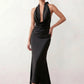 Shop the Women's Georgina Satin Cowl Neck Halter Maxi Dress. Featuring glossy satin, a draped halter neckline, open tie-back design, and a flattering mermaid silhouette, this elegant floor-length gown is perfect for weddings, black-tie events, proms, galas, and special occasions.