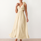 Woman wearing the Giedre Lace-Up A-Line Midi Dress featuring a deep V-neckline, ruffle shoulder sleeves, side waist cut-outs, adjustable lace-up open back and a flowing A-line midi skirt, ideal for weddings, race days and special occasions.
