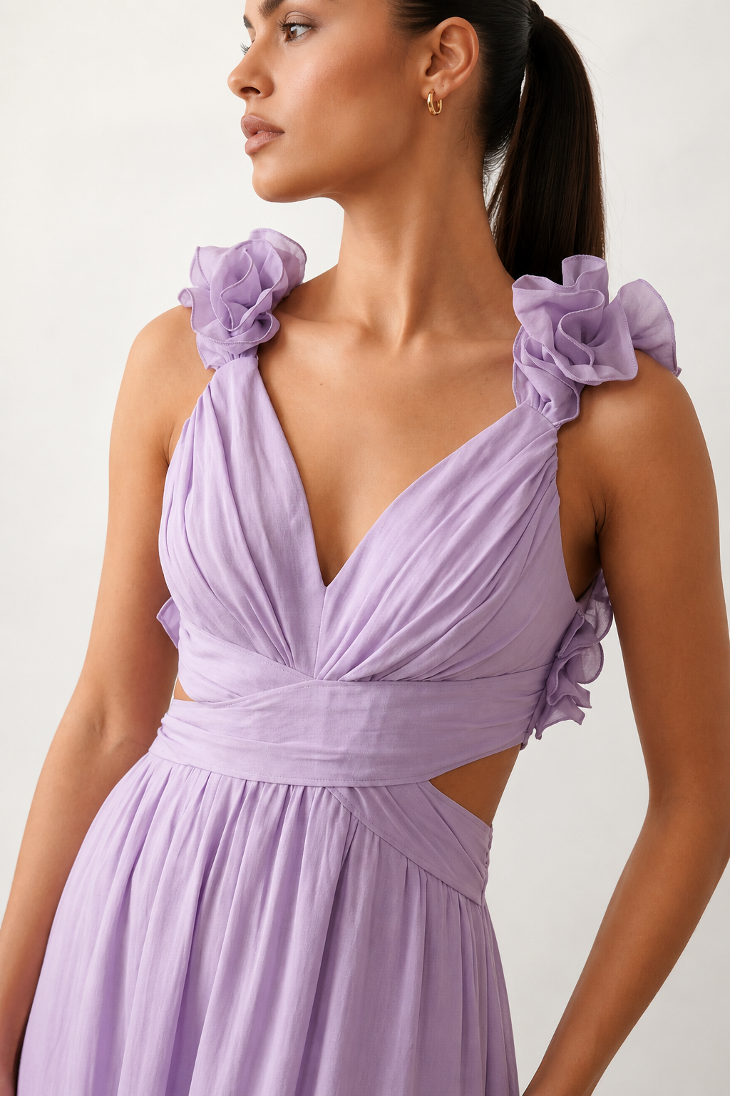 Woman wearing the Giedre Lace-Up A-Line Midi Dress featuring a deep V-neckline, ruffle shoulder sleeves, side waist cut-outs, adjustable lace-up open back and a flowing A-line midi skirt, ideal for weddings, race days and special occasions.
