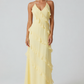 Women's halter neck ruffle maxi dress in a flowing full-length silhouette with soft ruffle detailing, lightweight fabric, and an elegant evening design.