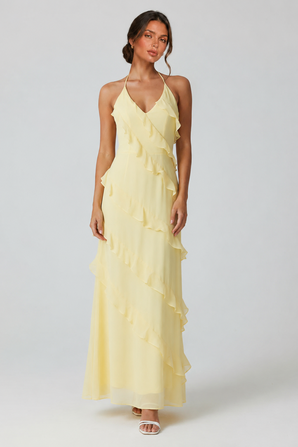Women's halter neck ruffle maxi dress in a flowing full-length silhouette with soft ruffle detailing, lightweight fabric, and an elegant evening design.