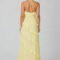 Women's halter neck ruffle maxi dress in a flowing full-length silhouette with soft ruffle detailing, lightweight fabric, and an elegant evening design.