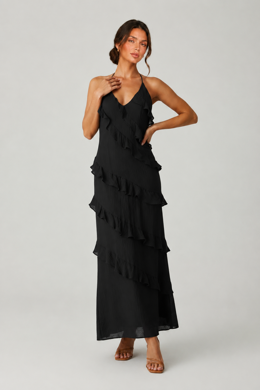Women's halter neck ruffle maxi dress in a flowing full-length silhouette with soft ruffle detailing, lightweight fabric, and an elegant evening design.