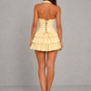 Women's halter ruffle mini dress featuring a corset-inspired fitted bodice, open back, layered ruffle skirt, and feminine flared silhouette, perfect for summer parties, wedding guests, and special occasions.