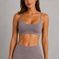 Women's high-waist straight-leg stretch trousers in smooth fabric with elastic waistband and side pockets, offering a flattering tailored fit and all-day comfort.