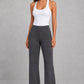 Women's high-waist straight-leg stretch trousers in smooth fabric with elastic waistband and side pockets, offering a flattering tailored fit and all-day comfort.
