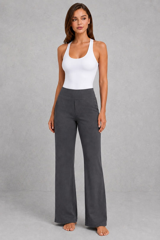 Women's high-waist straight-leg stretch trousers in smooth fabric with elastic waistband and side pockets, offering a flattering tailored fit and all-day comfort.