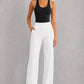 Women's high-waist straight-leg stretch trousers in smooth fabric with elastic waistband and side pockets, offering a flattering tailored fit and all-day comfort.