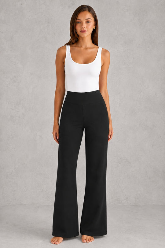 Women's high-waist straight-leg stretch trousers in smooth fabric with elastic waistband and side pockets, offering a flattering tailored fit and all-day comfort.