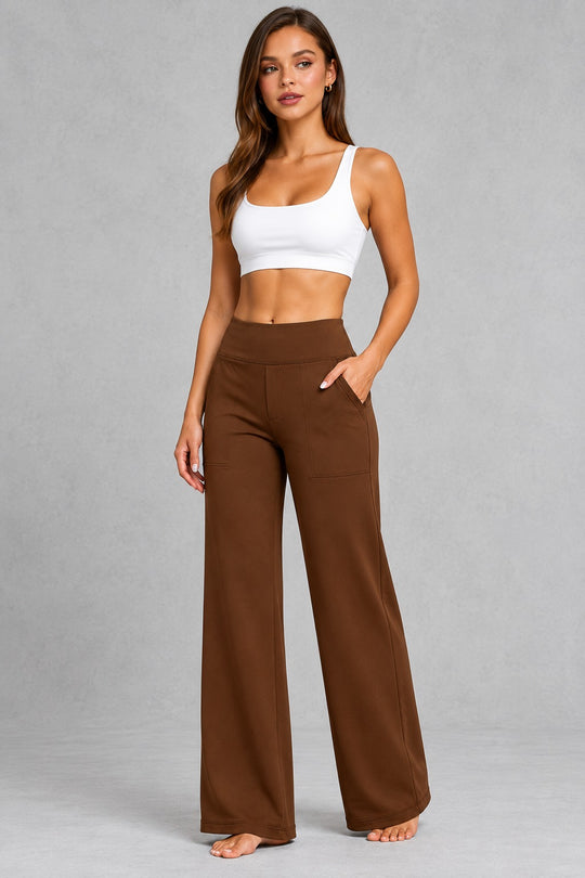 Women's high-waist straight-leg stretch trousers in smooth fabric with elastic waistband and side pockets, offering a flattering tailored fit and all-day comfort.