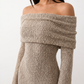 Woman wearing the Iustina Off Shoulder Fitted Maxi Dress featuring a Bardot neckline, soft draped shoulders, full-length sleeves, textured stretch knit fabric and a fitted floor-length silhouette, ideal for formal occasions and evening events.