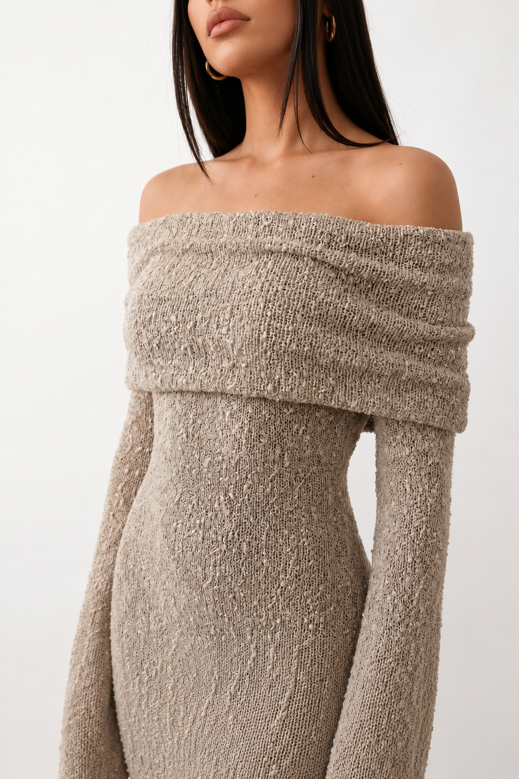 Woman wearing the Iustina Off Shoulder Fitted Maxi Dress featuring a Bardot neckline, soft draped shoulders, full-length sleeves, textured stretch knit fabric and a fitted floor-length silhouette, ideal for formal occasions and evening events.
