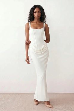 Women's Justina basque waist corset maxi dress featuring a structured boned bodice, square neckline, adjustable wide straps, ruched hip draping, side split, and a fitted floor-length silhouette for elegant evening and occasion wear.