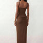 Women's Justina basque waist corset maxi dress featuring a structured boned bodice, square neckline, adjustable wide straps, ruched hip draping, side split, and a fitted floor-length silhouette for elegant evening and occasion wear.
