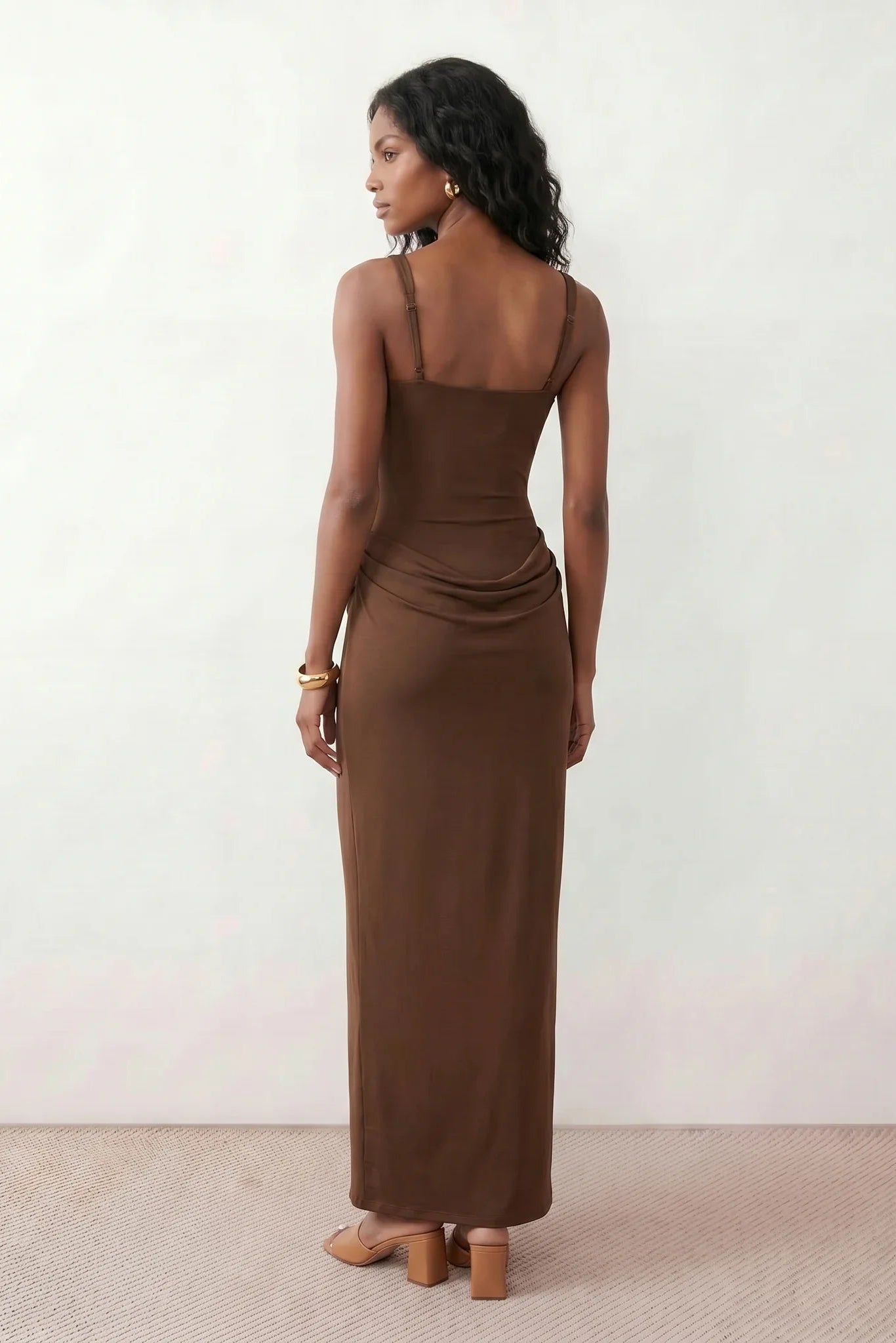 Women's Justina basque waist corset maxi dress featuring a structured boned bodice, square neckline, adjustable wide straps, ruched hip draping, side split, and a fitted floor-length silhouette for elegant evening and occasion wear.