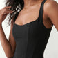 Women's Justina basque waist corset maxi dress featuring a structured boned bodice, square neckline, adjustable wide straps, ruched hip draping, side split, and a fitted floor-length silhouette for elegant evening and occasion wear.