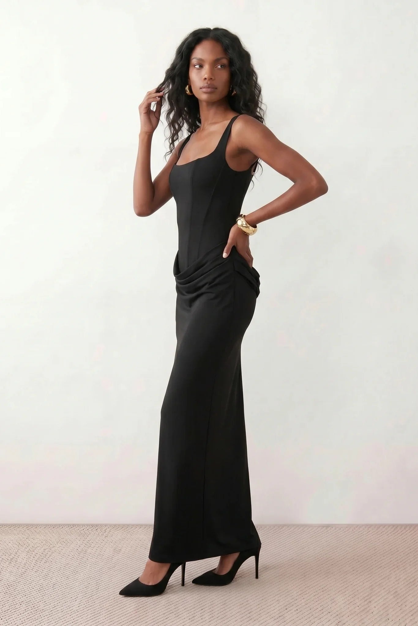 Women's Justina basque waist corset maxi dress featuring a structured boned bodice, square neckline, adjustable wide straps, ruched hip draping, side split, and a fitted floor-length silhouette for elegant evening and occasion wear.