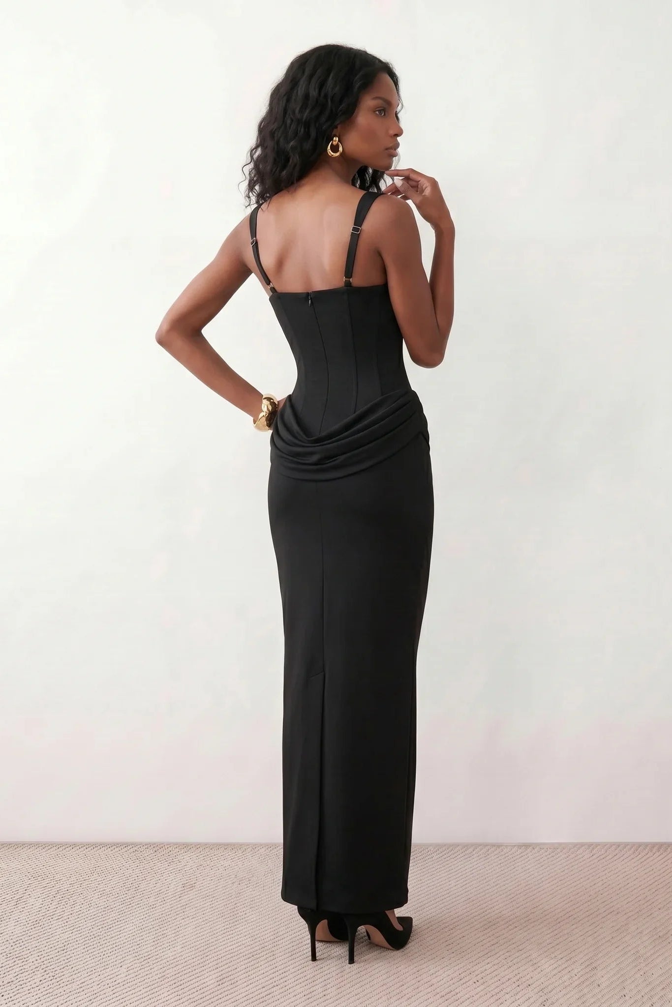 Women's Justina basque waist corset maxi dress featuring a structured boned bodice, square neckline, adjustable wide straps, ruched hip draping, side split, and a fitted floor-length silhouette for elegant evening and occasion wear.