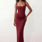 Women's Justina basque waist corset maxi dress featuring a structured boned bodice, square neckline, adjustable wide straps, ruched hip draping, side split, and a fitted floor-length silhouette for elegant evening and occasion wear.