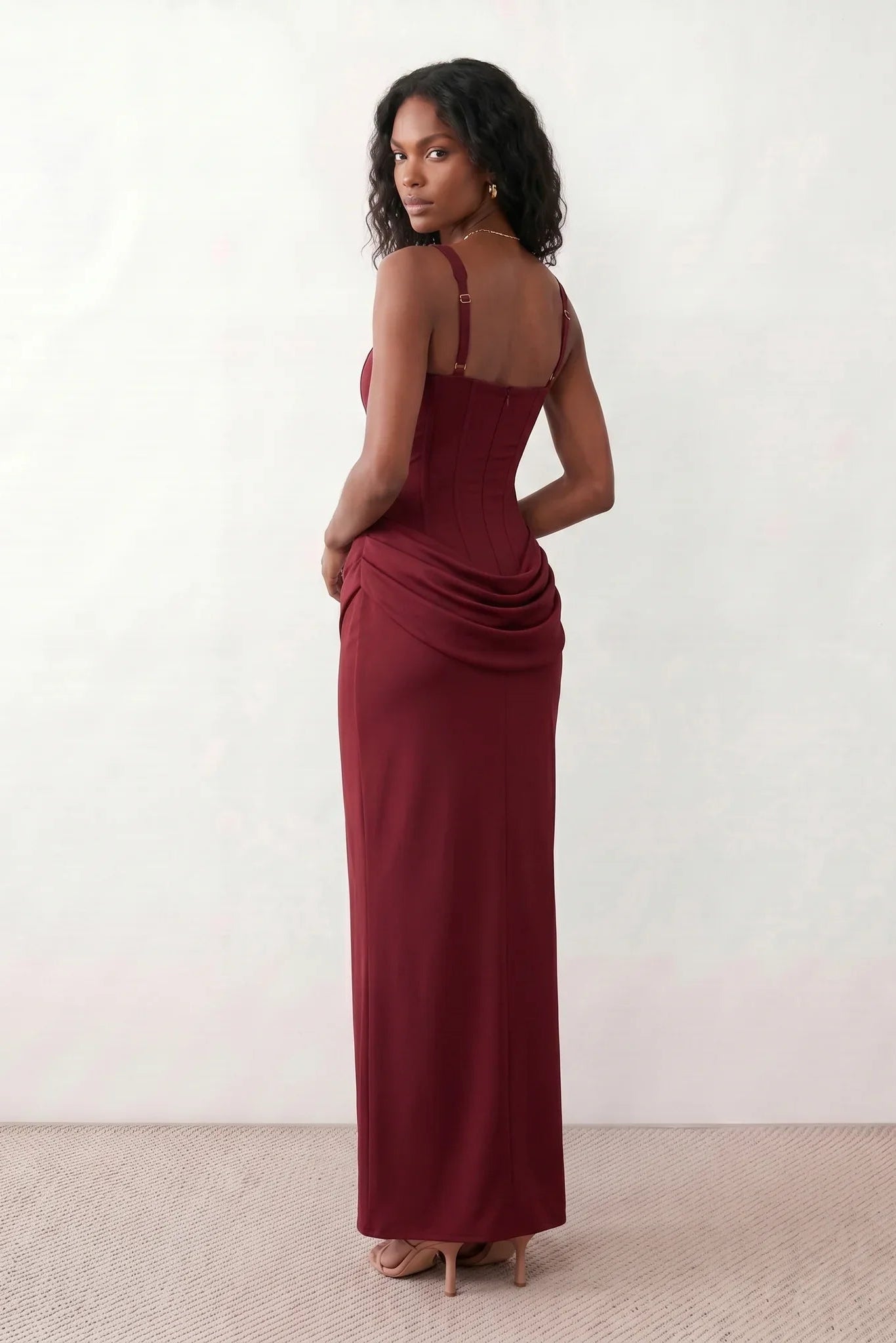 Women's Justina basque waist corset maxi dress featuring a structured boned bodice, square neckline, adjustable wide straps, ruched hip draping, side split, and a fitted floor-length silhouette for elegant evening and occasion wear.