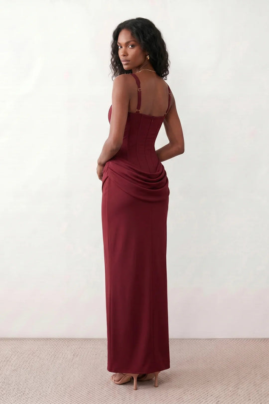 Women's Justina basque waist corset maxi dress featuring a structured boned bodice, square neckline, adjustable wide straps, ruched hip draping, side split, and a fitted floor-length silhouette for elegant evening and occasion wear.