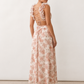 Woman wearing the Giedre Lace-Up A-Line Midi Dress featuring a deep V-neckline, ruffle shoulder sleeves, side waist cut-outs, adjustable lace-up open back and a flowing A-line midi skirt, ideal for weddings, race days and special occasions.