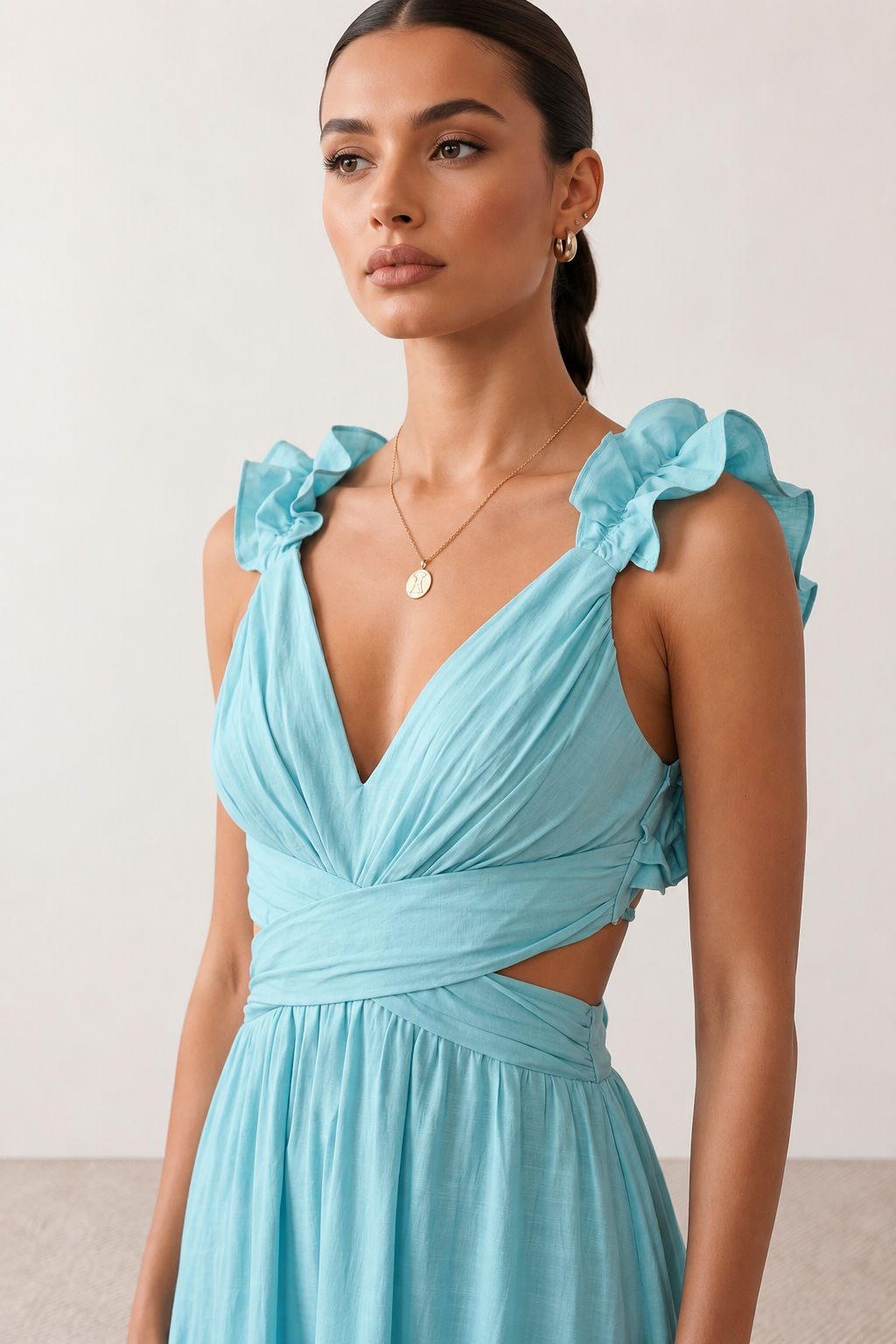 Woman wearing the Giedre Lace-Up A-Line Midi Dress featuring a deep V-neckline, ruffle shoulder sleeves, side waist cut-outs, adjustable lace-up open back and a flowing A-line midi skirt, ideal for weddings, race days and special occasions.