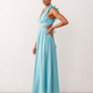 Woman wearing the Giedre Lace-Up A-Line Midi Dress featuring a deep V-neckline, ruffle shoulder sleeves, side waist cut-outs, adjustable lace-up open back and a flowing A-line midi skirt, ideal for weddings, race days and special occasions.