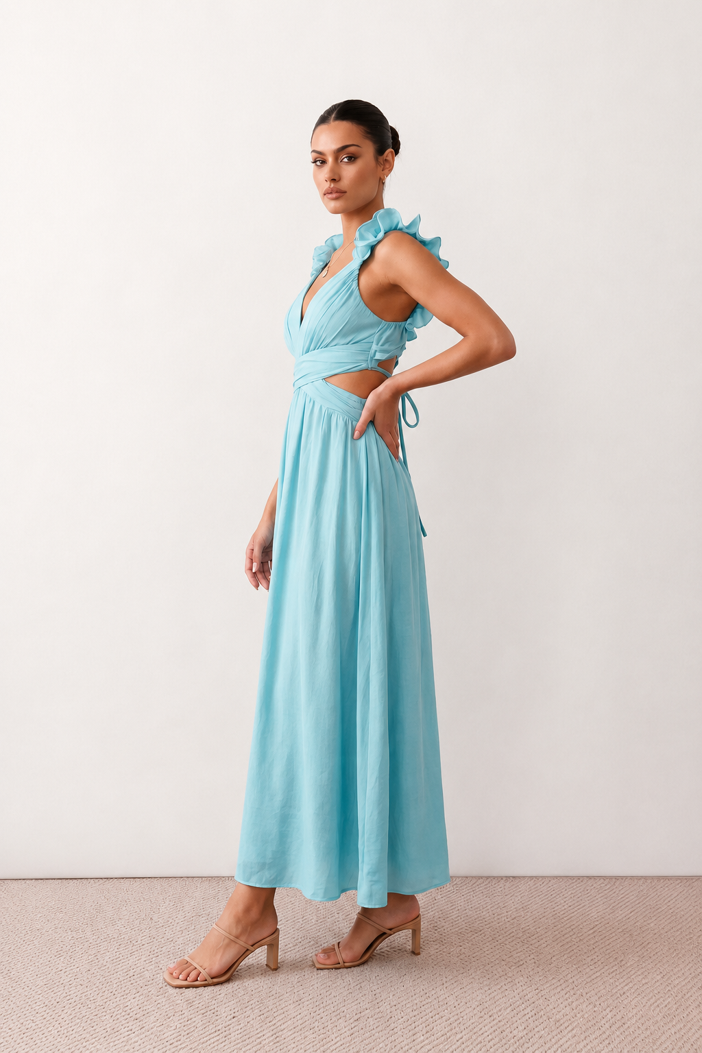 Woman wearing the Giedre Lace-Up A-Line Midi Dress featuring a deep V-neckline, ruffle shoulder sleeves, side waist cut-outs, adjustable lace-up open back and a flowing A-line midi skirt, ideal for weddings, race days and special occasions.