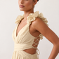 Woman wearing the Giedre Lace-Up A-Line Midi Dress featuring a deep V-neckline, ruffle shoulder sleeves, side waist cut-outs, adjustable lace-up open back and a flowing A-line midi skirt, ideal for weddings, race days and special occasions.