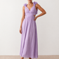 Woman wearing the Giedre Lace-Up A-Line Midi Dress featuring a deep V-neckline, ruffle shoulder sleeves, side waist cut-outs, adjustable lace-up open back and a flowing A-line midi skirt, ideal for weddings, race days and special occasions.
