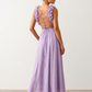 Woman wearing the Giedre Lace-Up A-Line Midi Dress featuring a deep V-neckline, ruffle shoulder sleeves, side waist cut-outs, adjustable lace-up open back and a flowing A-line midi skirt, ideal for weddings, race days and special occasions.
