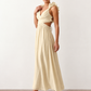 Woman wearing the Giedre Lace-Up A-Line Midi Dress featuring a deep V-neckline, ruffle shoulder sleeves, side waist cut-outs, adjustable lace-up open back and a flowing A-line midi skirt, ideal for weddings, race days and special occasions.