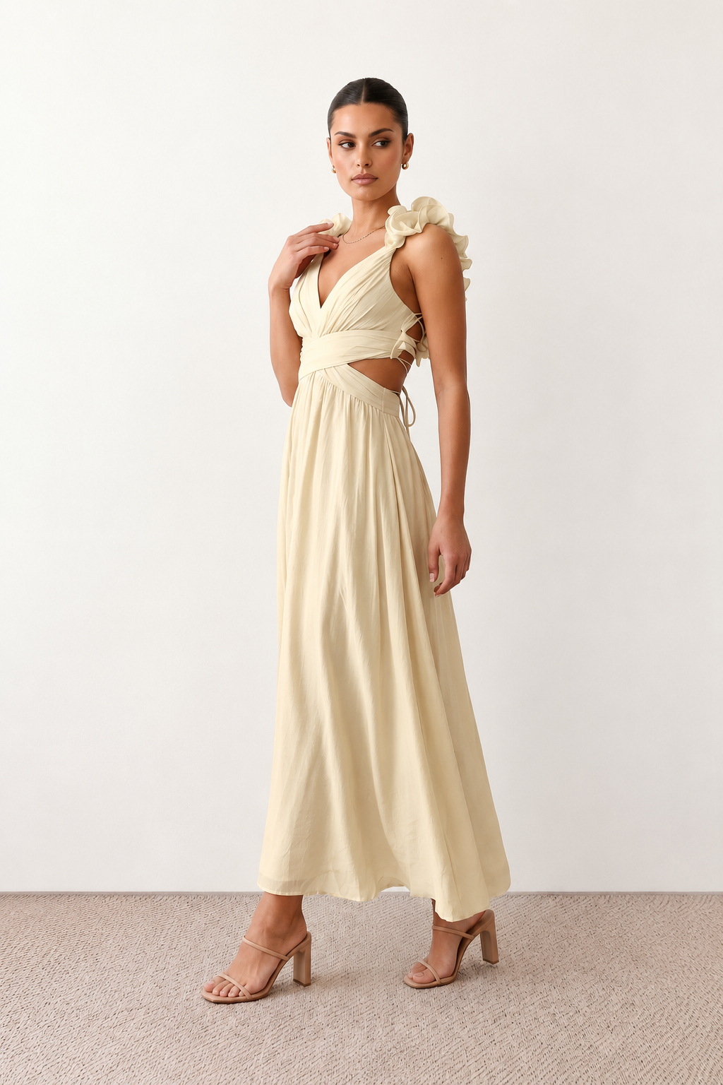Woman wearing the Giedre Lace-Up A-Line Midi Dress featuring a deep V-neckline, ruffle shoulder sleeves, side waist cut-outs, adjustable lace-up open back and a flowing A-line midi skirt, ideal for weddings, race days and special occasions.